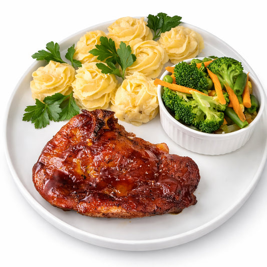 Slow-cooked BBQ  Pork Chops, Creamy Garlic Mashed Potatoes, Steamed Vegetables